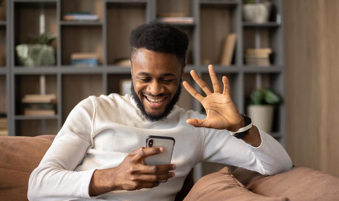 influencer livestream waving at camera phone